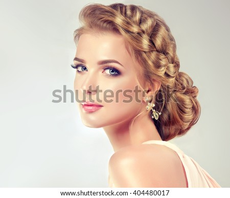 http://thumb101.shutterstock.com/display_pic_with_logo/1054231/404480017/stock-photo-beautiful-model-with-elegant-hairstyle-beautiful-woman-with-fashion-wedding-hair-and-colourful-404480017.jpg