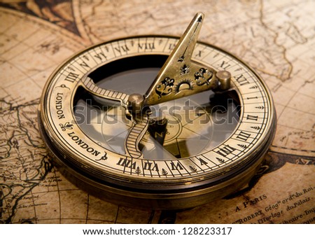 stock-photo-old-compass-on-vintage-map-128223317.jpg