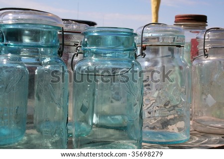Vintage jars lined up on a table stock photo greenhouse cafe puerto rico Vintage jars lined up on a table stock photo greenhouse cafe puerto rico