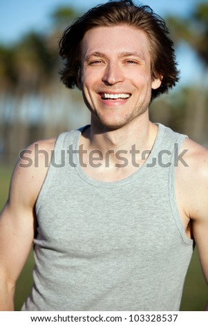 Smiling young active man outside - stock photo - stock-photo-smiling-young-active-man-outside-103328537