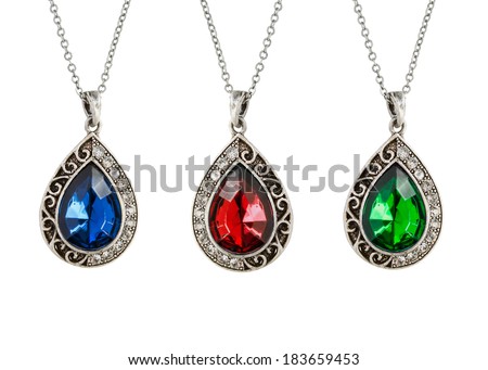 Three vintage silver drop shaped pendants with gemstones on white ... Three vintage silver drop shaped pendants with gemstones on white ...