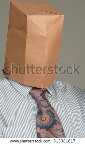 stock-photo-unidentified-man-wearing-a-bag-over-his-head-315361817.jpg