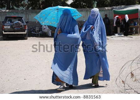 stock-photo-burka-and-umbrella-8831563.j