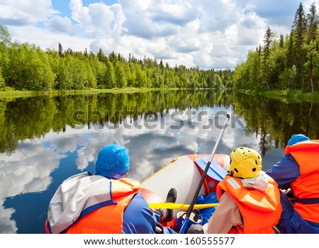 Rafters in a rafting boat on Pistojoki river in Karelia, Russia 