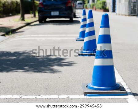 stock-photo-traffic-cones-standing-in-a-row-on-the-roadside-299945453.jpg