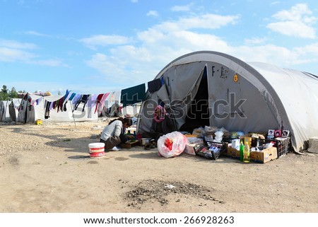 http://thumb101.shutterstock.com/display_pic_with_logo/2281994/266928263/stock-photo-syrian-people-in-refugee-camp-in-suruc-these-people-are-refugees-from-kobane-and-escaped-because-266928263.jpg