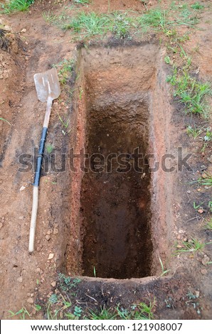 stock-photo-grave-just-been-digged-spade