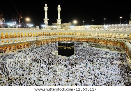 MECCA - JULY 21 : A crowd of pilgrims circumabulate (tawaf) Kaaba on July 21, 2012 in Mecca, Saudi Arabia. Pilgrims circumambulate the Kaaba seven times in counterclockwise direction. - stock photo