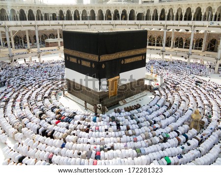 Kaaba the Holy mosque in Mecca with Muslim people pilgrims of Hajj praying in crowd (newest and very rare images of Holiest mosque after latest widening 2013-3014) - stock photo