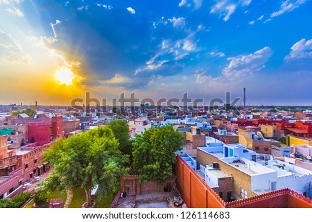 cityscape of Bikaner, old indian City in Rajasthan with a famous fort in sunset - stock photo