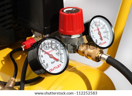 stock-photo-pressure-meters-and-compressor-safety-valve-closeup-112252583.jpg