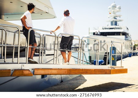 Yacht crew at port. - stock photo