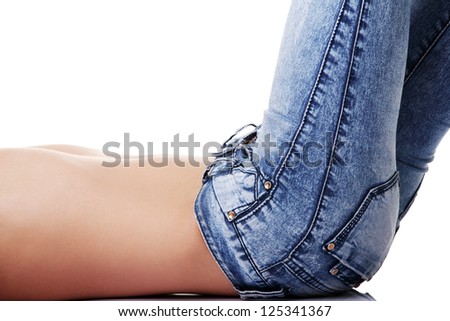 Fit female body in blue jeans, isolated on white - stock photo