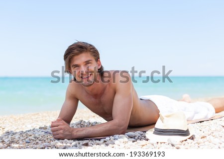 http://thumb101.shutterstock.com/display_pic_with_logo/534712/193369193/stock-photo-man-smile-lying-tanning-rest-on-beach-handsome-male-sunbathing-summer-vacation-sun-tanned-body-193369193.jpg