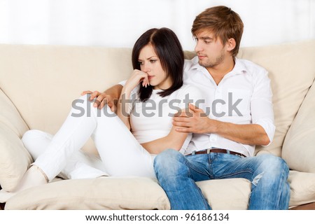 http://thumb101.shutterstock.com/display_pic_with_logo/534712/534712,1330280671,43/stock-photo-beautiful-young-couple-conflict-sitting-on-a-couch-argue-unhappy-portrait-young-man-and-woman-96186134.jpg