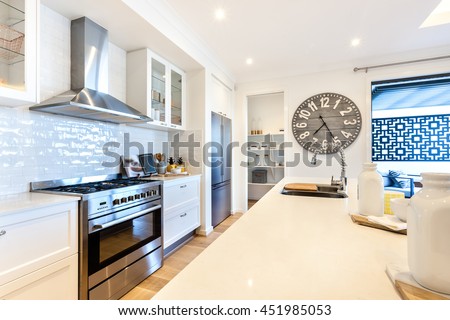 Luxury kitchen closeup with countertop and stove under the oven next ...