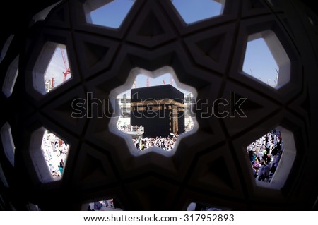 MECCA, SAUDI ARABIA-CIRCA MAY 2015: Muslims are doing tawaf around the Kaaba in Masjidil Haram on MAY, 2015 in Makkah, Saudi Arabia. Muslims all around the world come here doing umrah and hajj
 - stock photo