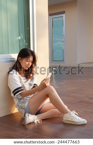 http://thumb101.shutterstock.com/display_pic_with_logo/607489/244477663/stock-photo-portrait-of-teen-woman-with-serious-face-looking-and-reading-message-on-mobile-phone-by-unhappy-244477663.jpg