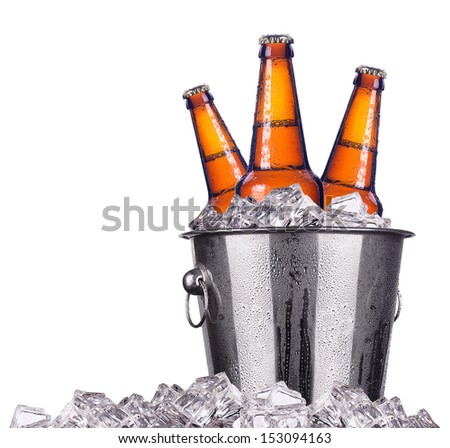 Beer bottles in ice bucket isolated on white  stock photo