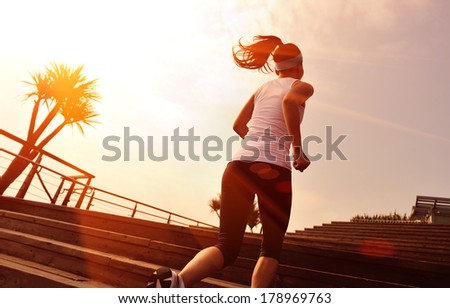 healthy lifestyle sports woman running up on wooden stairs - stock ...