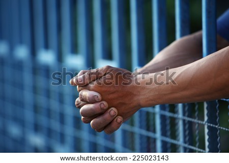 hand in jail - stock photo