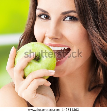 stock-photo-portrait-of-young-woman-eati