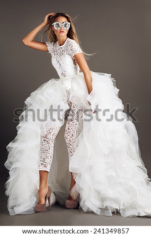 stock-photo-beautiful-model-posing-in-wedding-dress-241349857.jpg