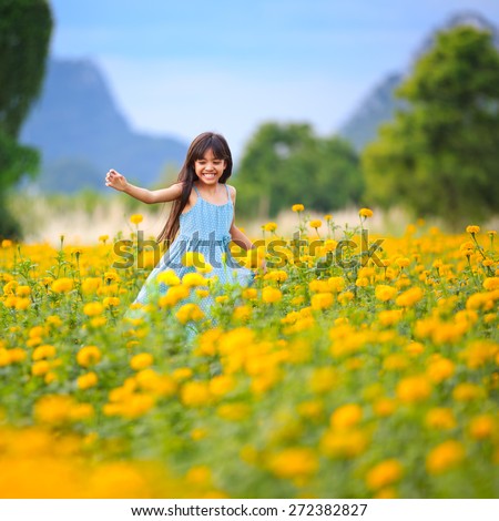 http://thumb101.shutterstock.com/display_pic_with_logo/849775/272382827/stock-photo-happy-little-asian-girl-running-on-the-marigold-field-272382827.jpg