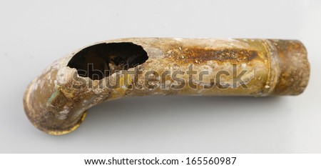 thumb101.shutterstock.com/display_pic_with_logo/940660/165560987/stock-photo-section-of-worn-out-brass-drain-pipe-with-ragged-gaping-hole-in-outward-portion-of-curve-against-165560987.jpg