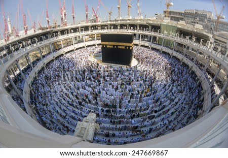 MECCA, SAUDI ARABIA-CIRCA DEC 2014:Muslims in ready for praying facing the Kaaba at Masjidil Haram in Makkah, Saudi Arabia. Muslims all around the world face the Kaaba during prayer time. - stock photo