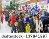 MOSCOW - NOV 4: People with children stand in queue to oceanarium at shopping mall RIO at Dmitrovsky highway, November 4, 2012, Moscow, Russia. This oceanariun first and biggest in Moscow. - stock photo