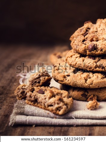 Chocolate chip cookies on natural linen napkin on wooden background ...