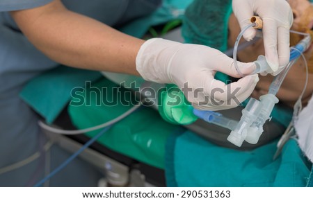 nurse suction endotracheal tube - stock photo