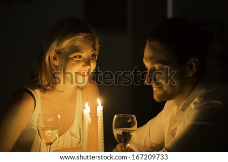 http://thumb101.shutterstock.com/display_pic_with_logo/1725881/167209733/stock-photo-a-woman-and-man-share-a-joke-over-a-glass-of-white-wine-at-a-candle-lit-table-167209733.jpg