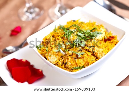 Aromatic pilaf with roasted spices, onion and fresh herbs - stock photo