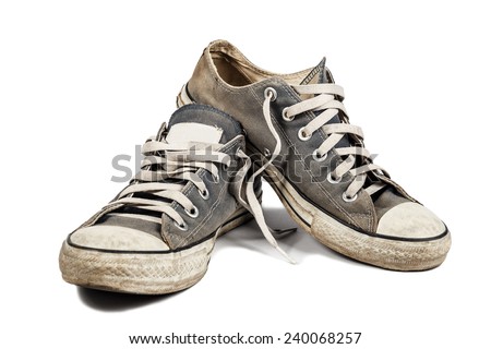 Old & dirty shoes isolated on white background - stock photo