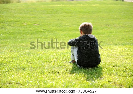 Sad abandoned orphan sitting in nature and contemplating, autism ...