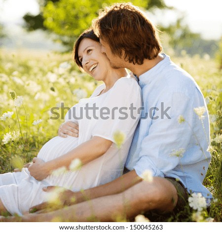 http://thumb101.shutterstock.com/display_pic_with_logo/559519/150045263/stock-photo-happy-and-young-pregnant-couple-hugging-in-nature-150045263.jpg