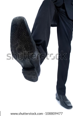 Business man foot trample closeup - stock photo