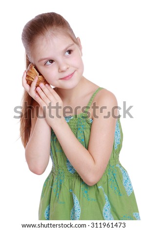 [Image: stock-photo-child-holding-seashell-on-wh...961473.jpg]