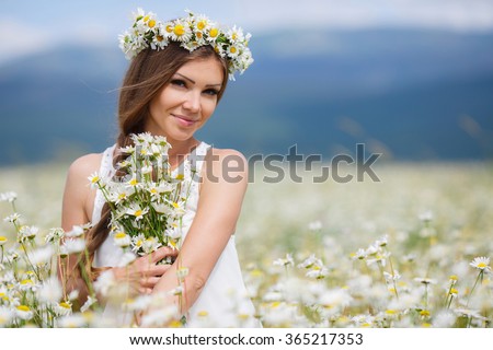 http://thumb101.shutterstock.com/display_pic_with_logo/745759/365217353/stock-photo-beautiful-woman-enjoying-daisy-field-nice-female-lying-down-in-meadow-of-flowers-pretty-girl-365217353.jpg