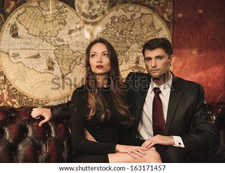 http://thumb101.shutterstock.com/display_pic_with_logo/78238/163171457/stock-photo-beautiful-woman-and-handsome-young-man-sitting-on-a-sofa-in-luxury-interior-163171457.jpg